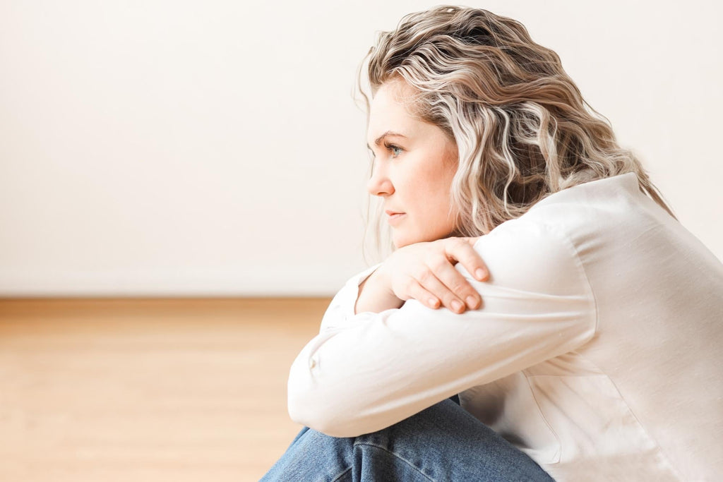  CES therapy for anxiety, a thoughtful woman experiencing high-functioning anxiety